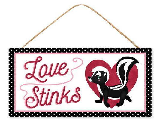 AP7170    12.5"L X 6"H Love Stinks/Skunk Sign    White/Pink/Red/Black